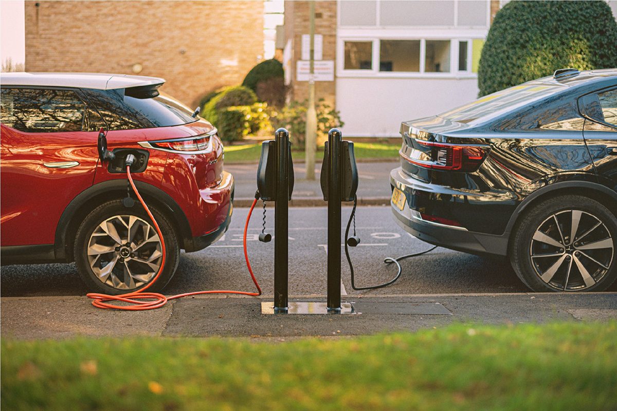 Electric cars at on-street charging bays on a Connected Kerb network.